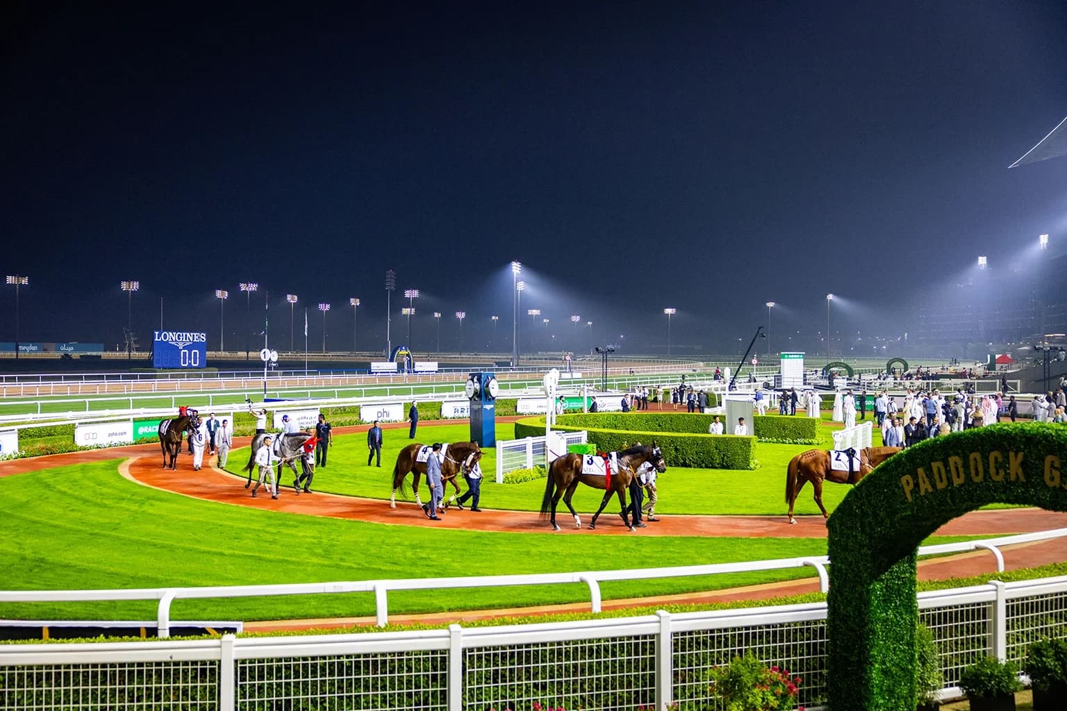 Horses and participants preparing for racing at Meydan